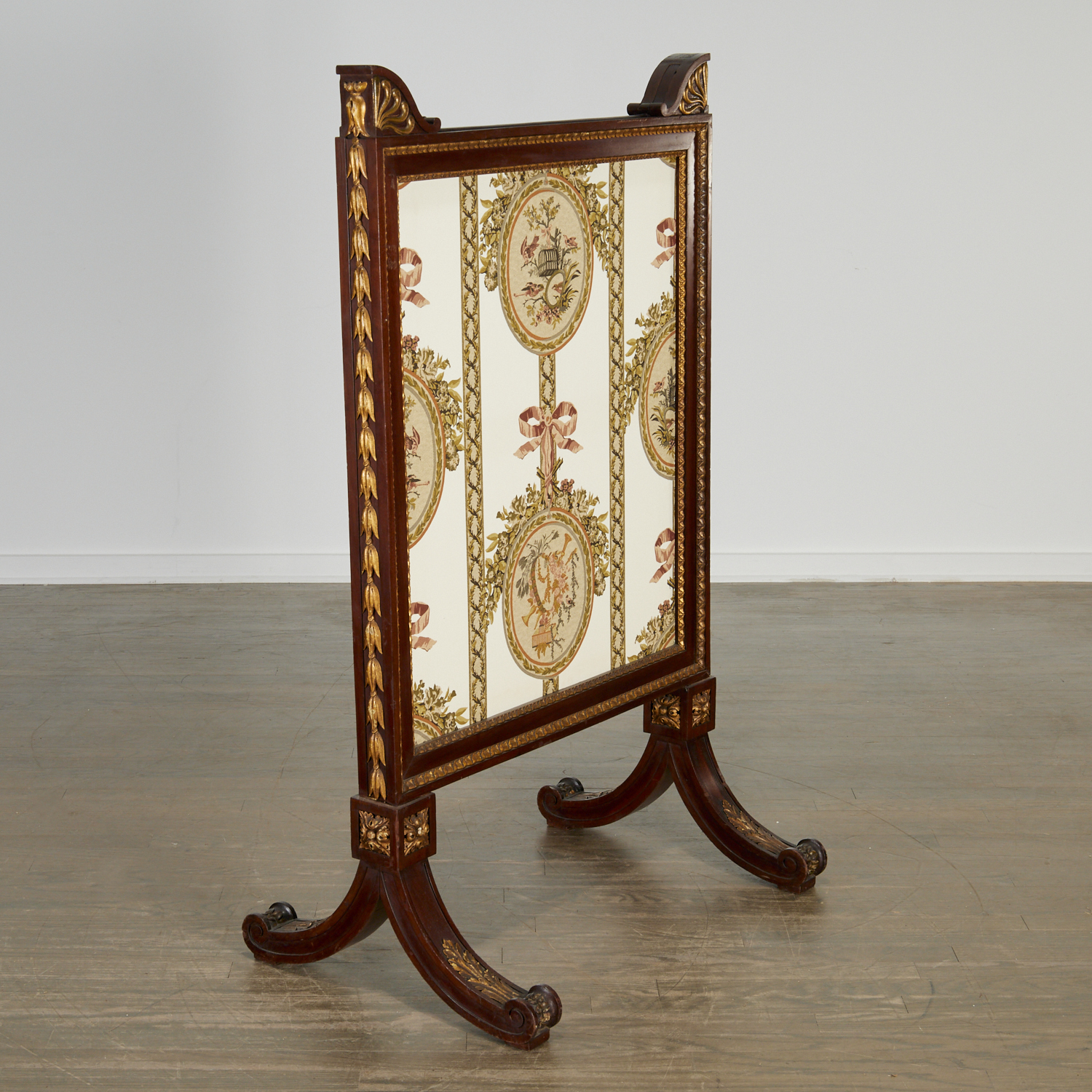 Appraisal: EMPIRE PARCEL GILT MAHOGANY FIRE SCREEN th c France the