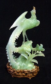 Appraisal: A Chinese figure of an exotic phoenix in carved green