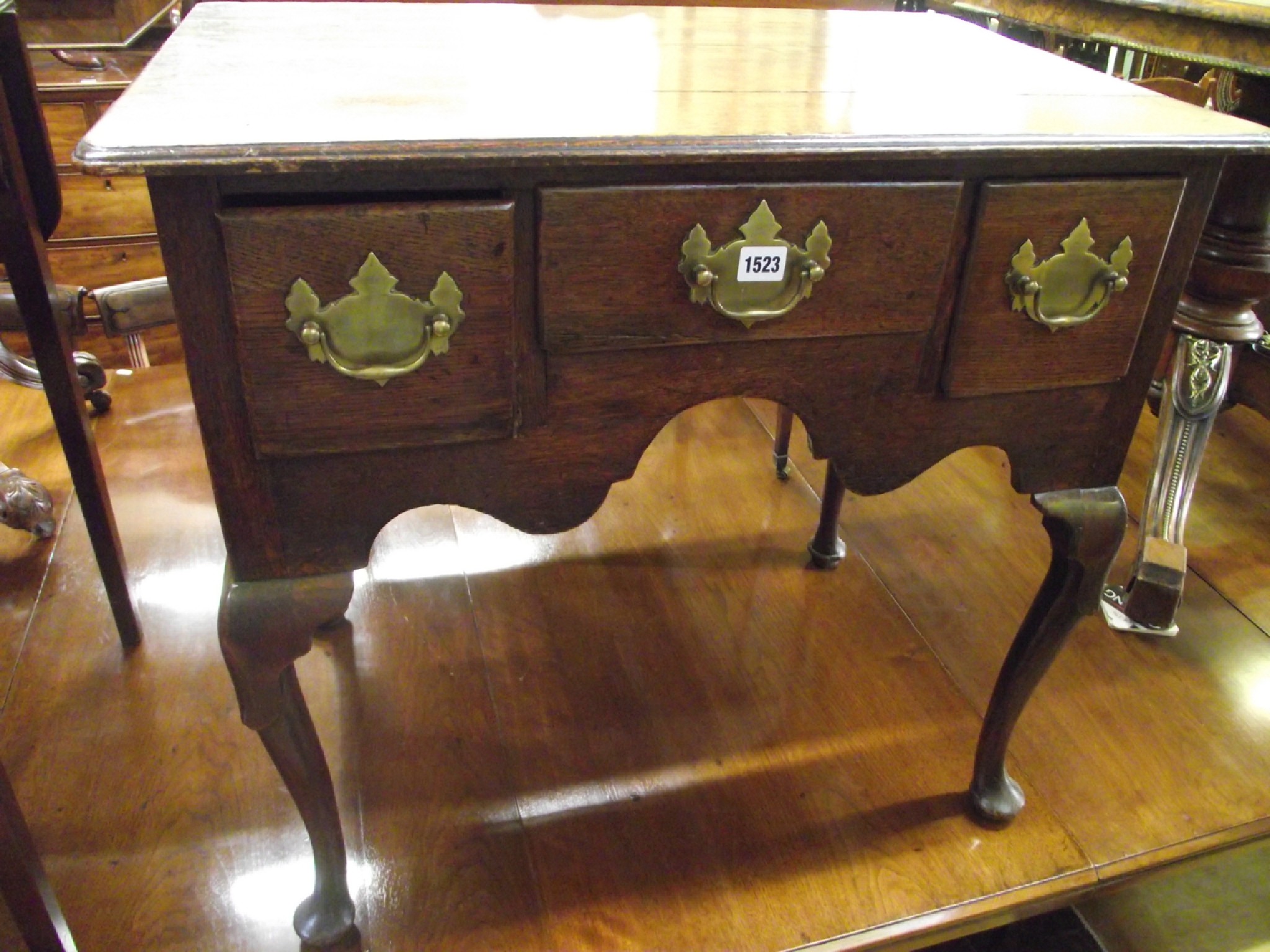 Appraisal: A Georgian oak country made lowboy fitted with three drawers