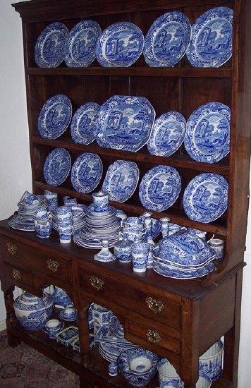 Appraisal: An oak dresser the closed rack with three shelves the