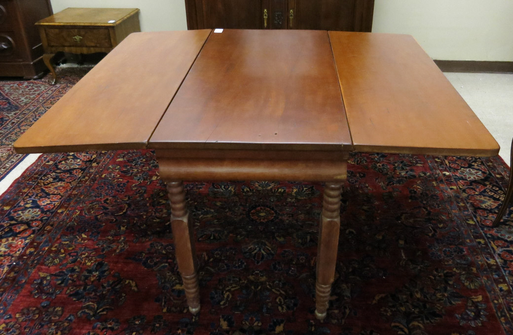 Appraisal: VICTORIAN DROP-LEAF CHERRY DINING TABLE American late th century rectangular