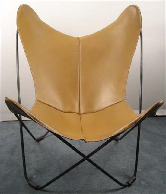 Appraisal: Butterfly Chair with tan leather and black iron frame tear