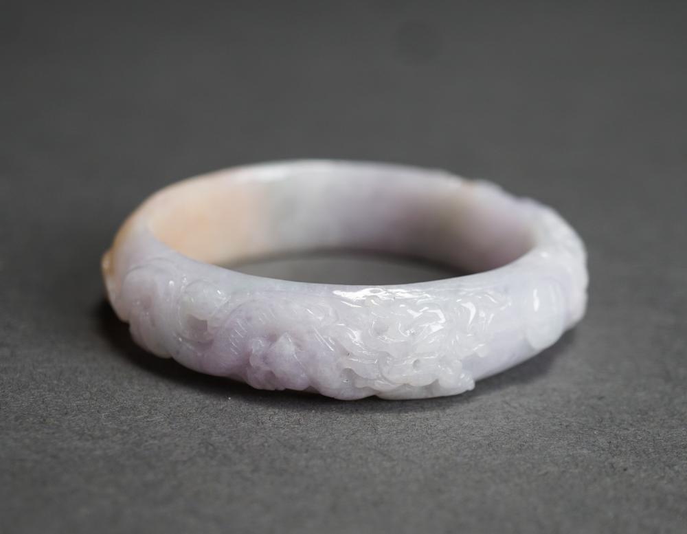 Appraisal: CARVED PALE LAVENDER TO MOTTLED JADE BANGLE BRACELET L APPROX