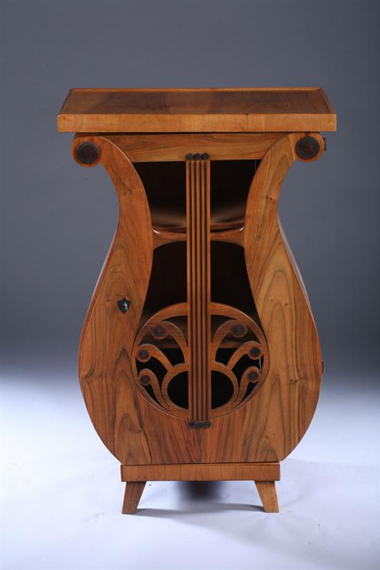 Appraisal: BIEDERMEIER LYRE-FORM CONSOLE CABINET th century Plinth top with raised