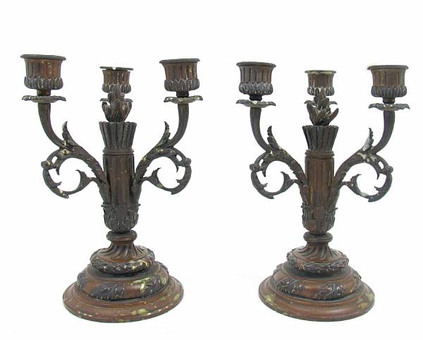 Appraisal: A pair of Louis XVI style patinated metal three light