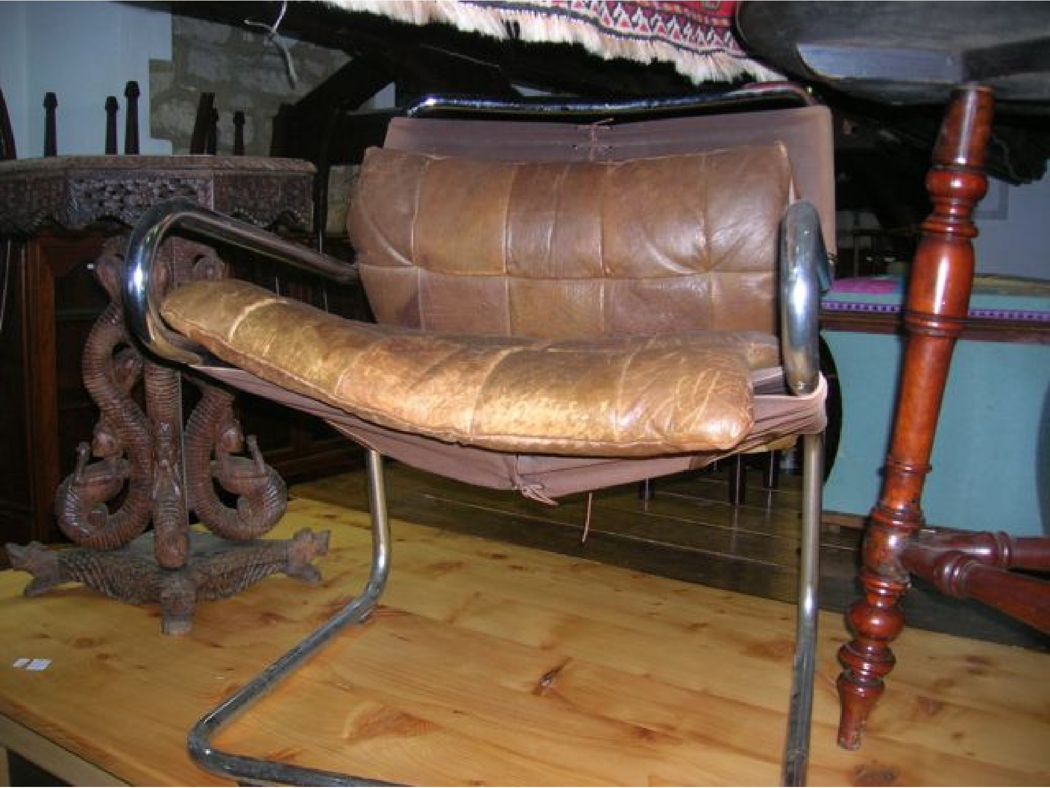 Appraisal: A mid th century design elbow chair with soft brown