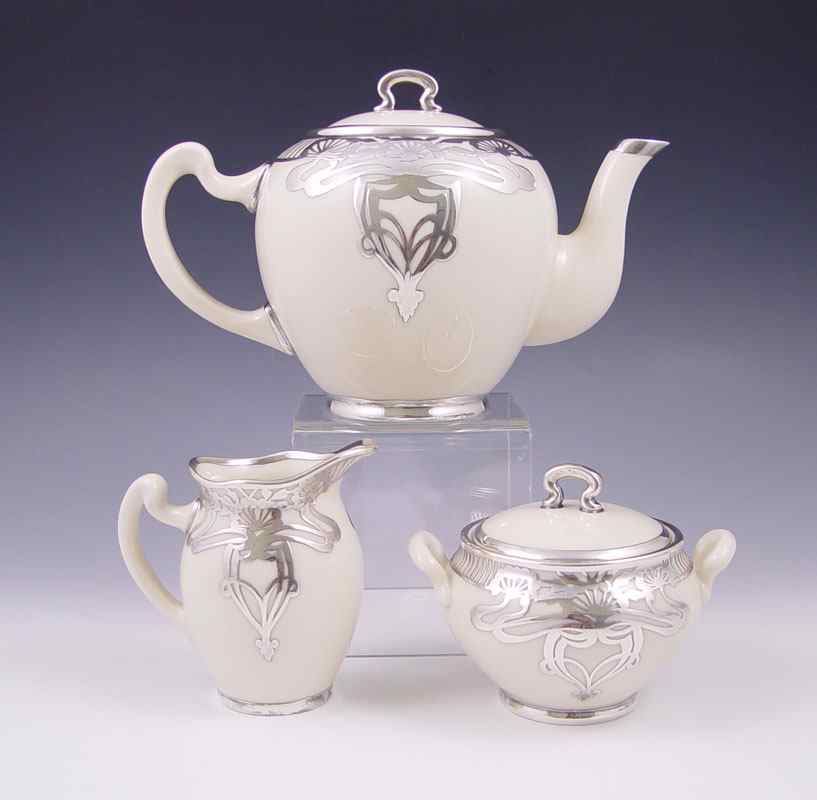 Appraisal: LENOX AMERICAN BELLEEK SILVER OVERLAY PIECE TEA SET Ca -