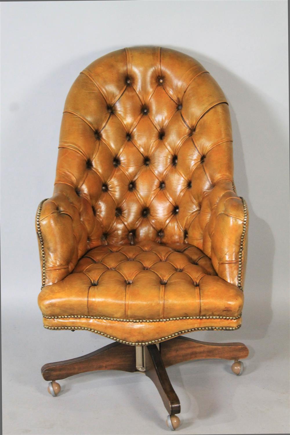 Appraisal: ENGLISH TUFTED LEATHER OFFICE CHAIR having a rounded top over