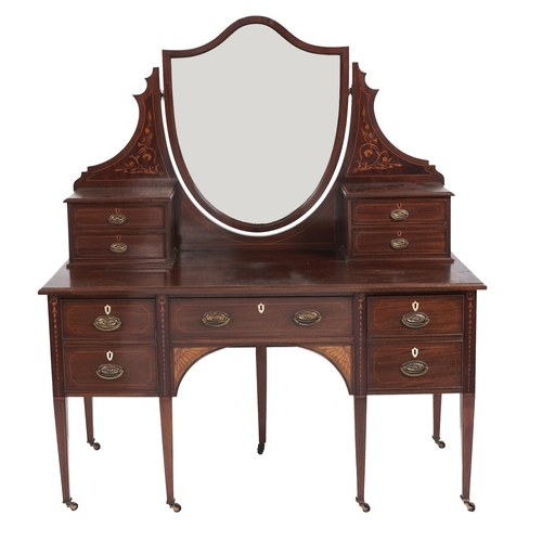 Appraisal: An Edwardian mahogany and inlaid dressing table with shield shaped