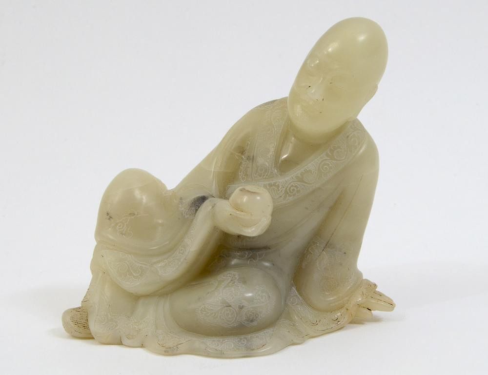 Appraisal: CHINESE CARVED SOAPSTONE SEATED LOHAN The pale green with gray