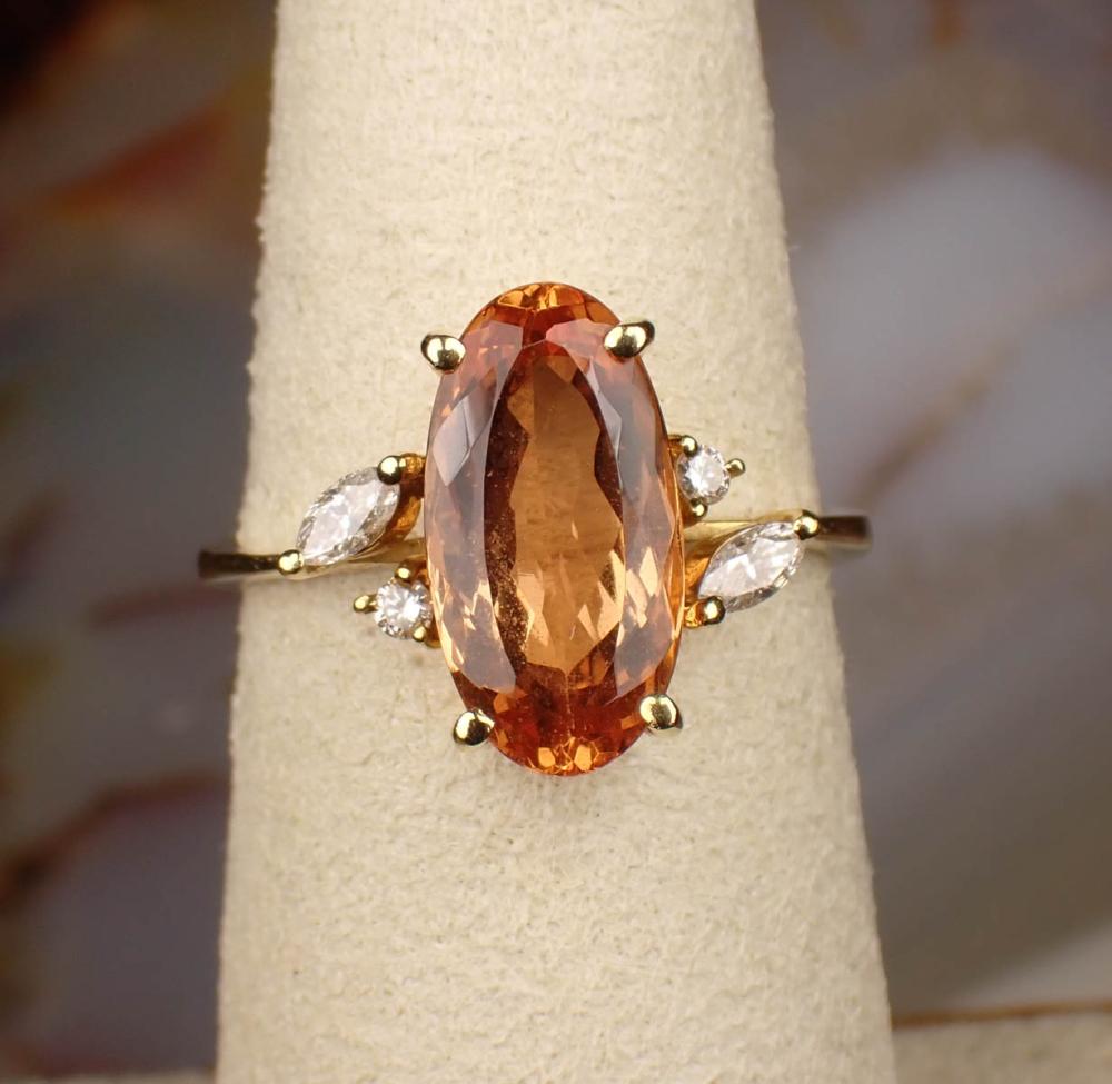 Appraisal: IMPERIAL TOPAZ DIAMOND AND EIGHTEEN KARAT GOLD RING The yellow