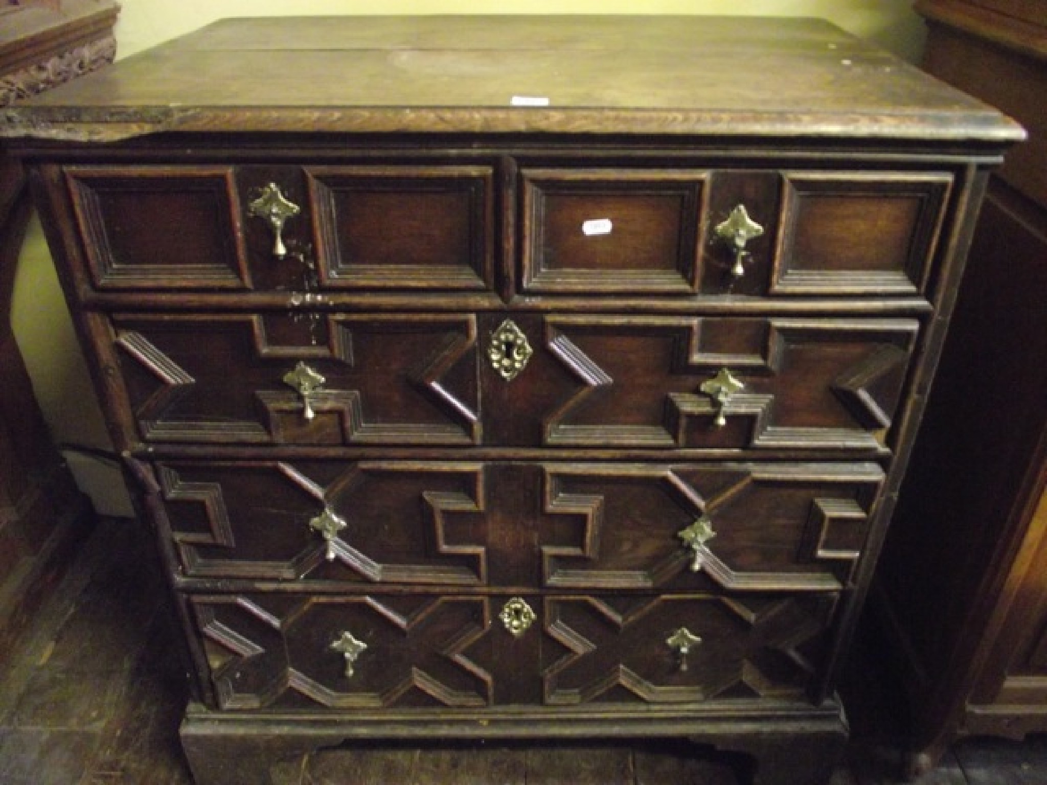 Appraisal: An th century oak two-sectional chest of three long and