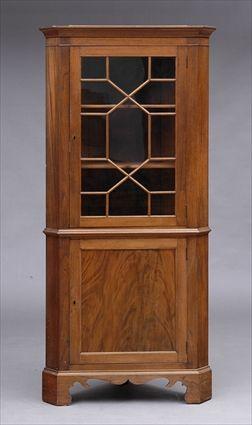 Appraisal: CHIPENDALE MAHOGANY CORNER CUPBOARD The plain cornice above a single