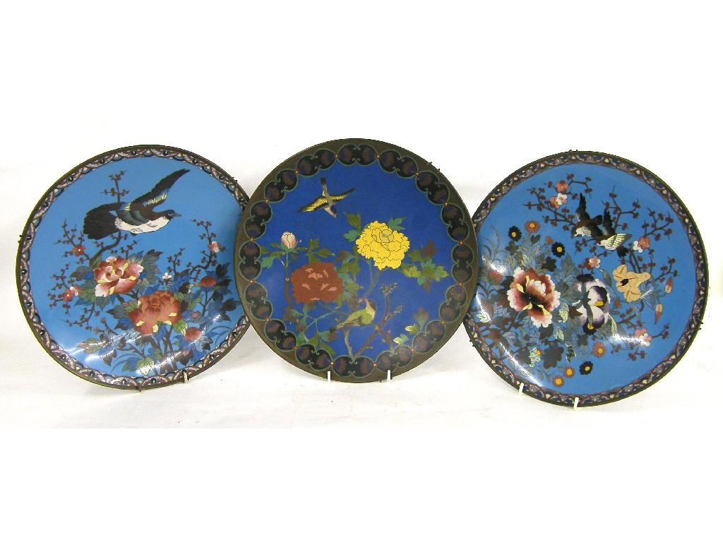 Appraisal: Pair of cloisonne chargers decorated with birds amidst flowering foliage