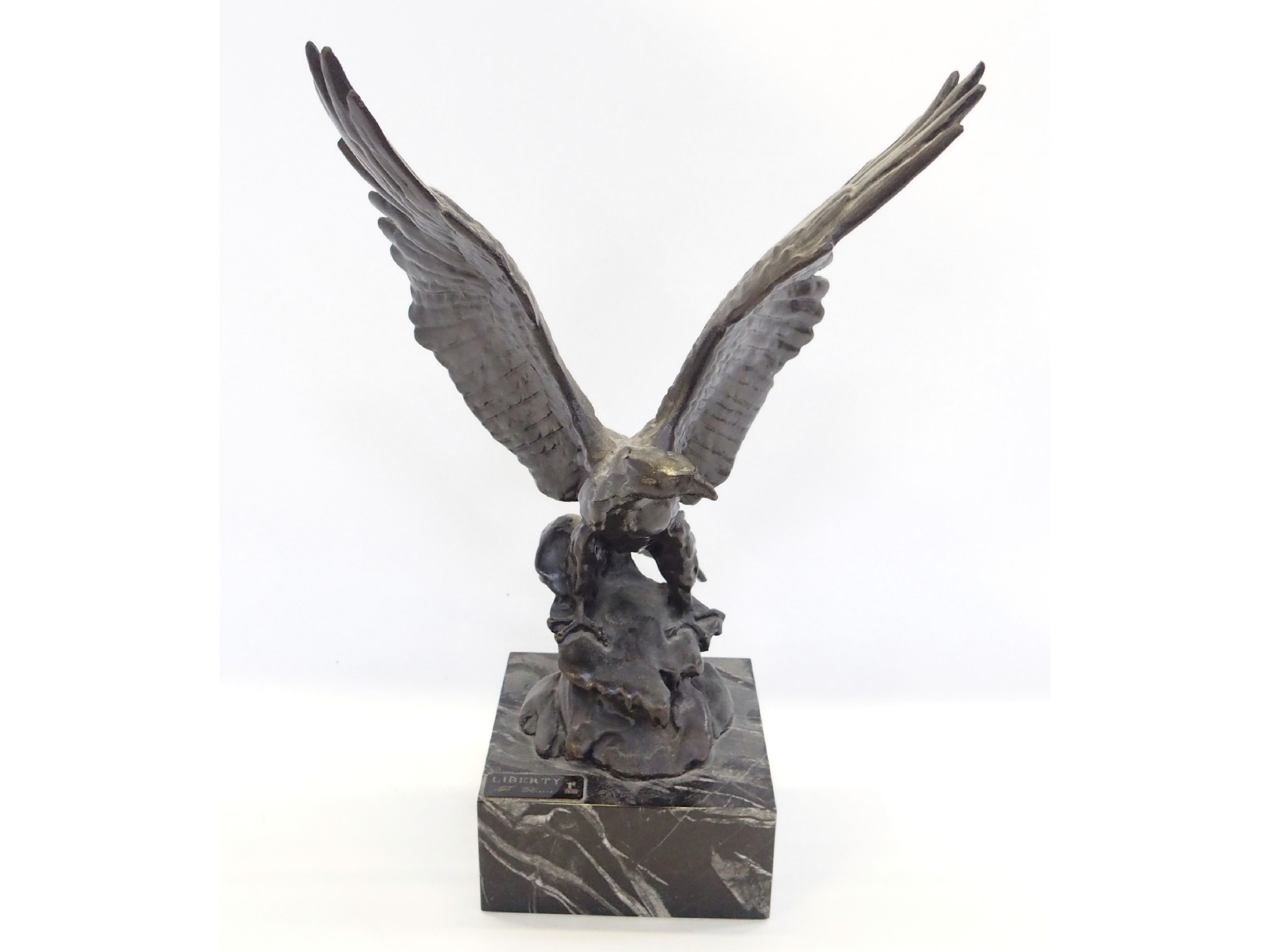 Appraisal: Bronze patinated figure of an eagle on black marble base