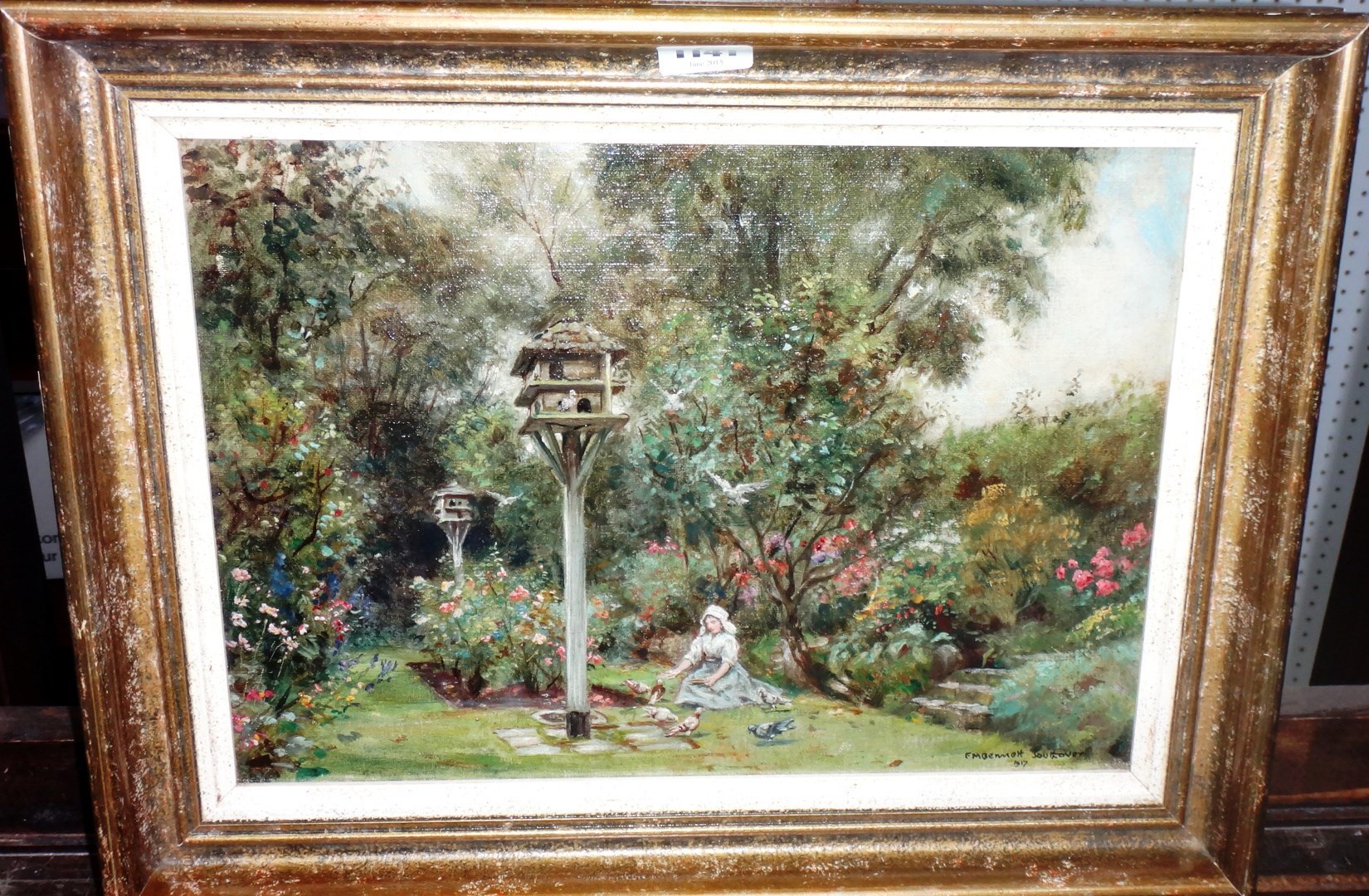 Appraisal: Frank Moss Bennett - A garden scene with a girl