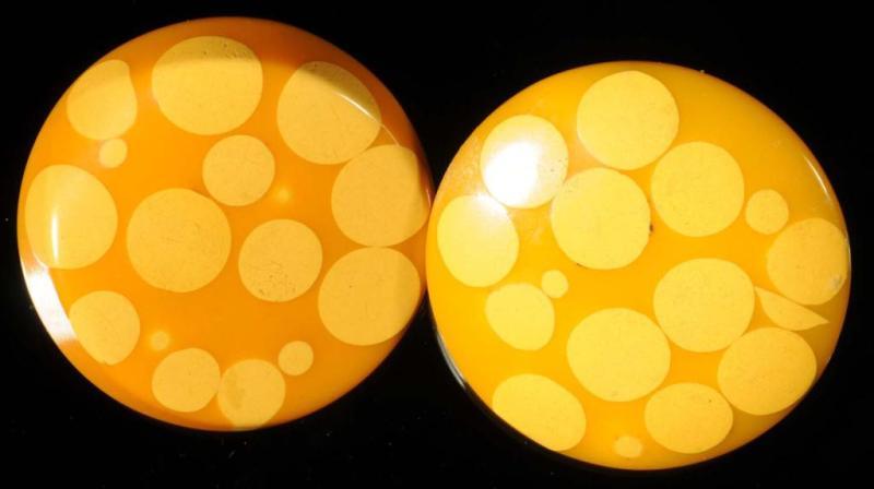 Appraisal: Large Bakelite Yellow Cream Random Dot Earrings Description Clip-ons marked