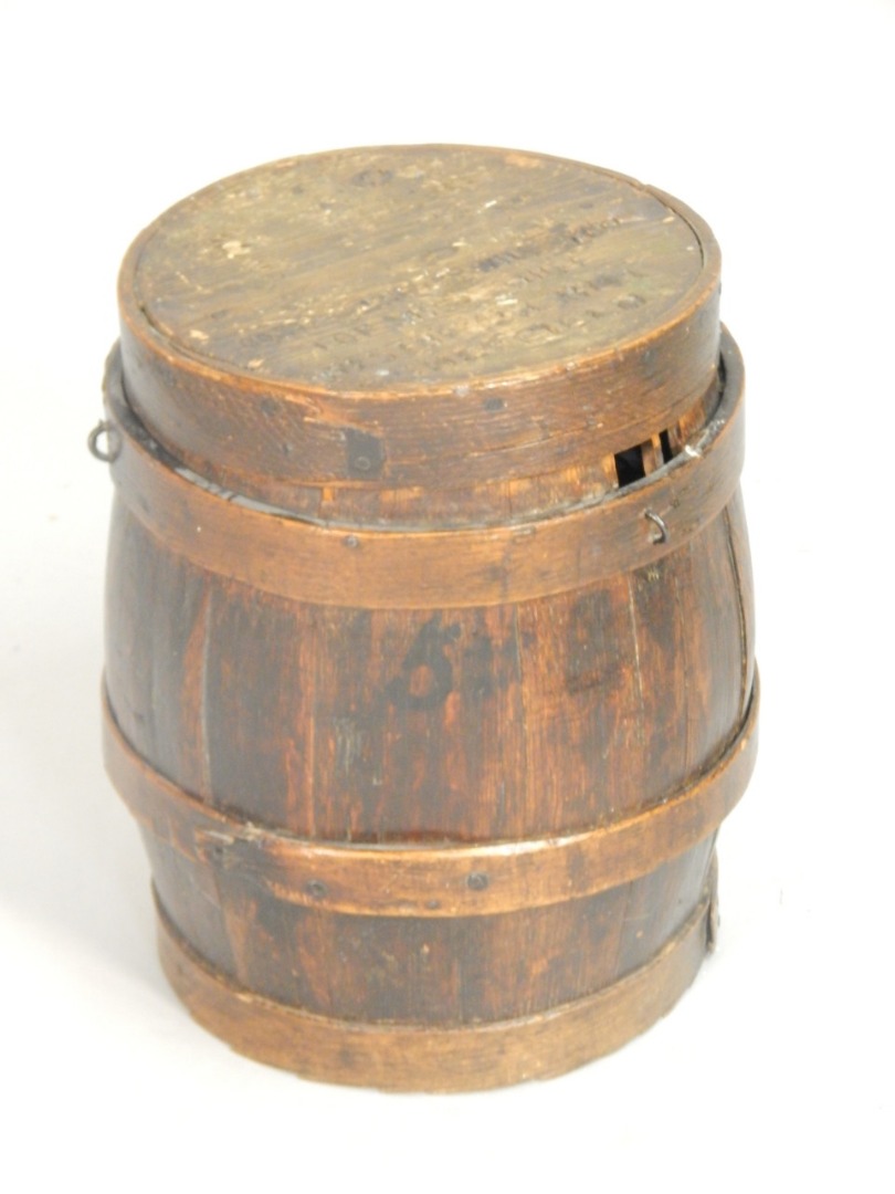 Appraisal: A thC coopered oak barrel the lid indistinctly stamped for