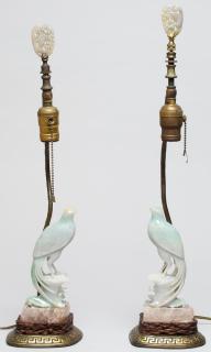 Appraisal: Pair of Chinese Figural Jade Bird Lamps The jades mounted