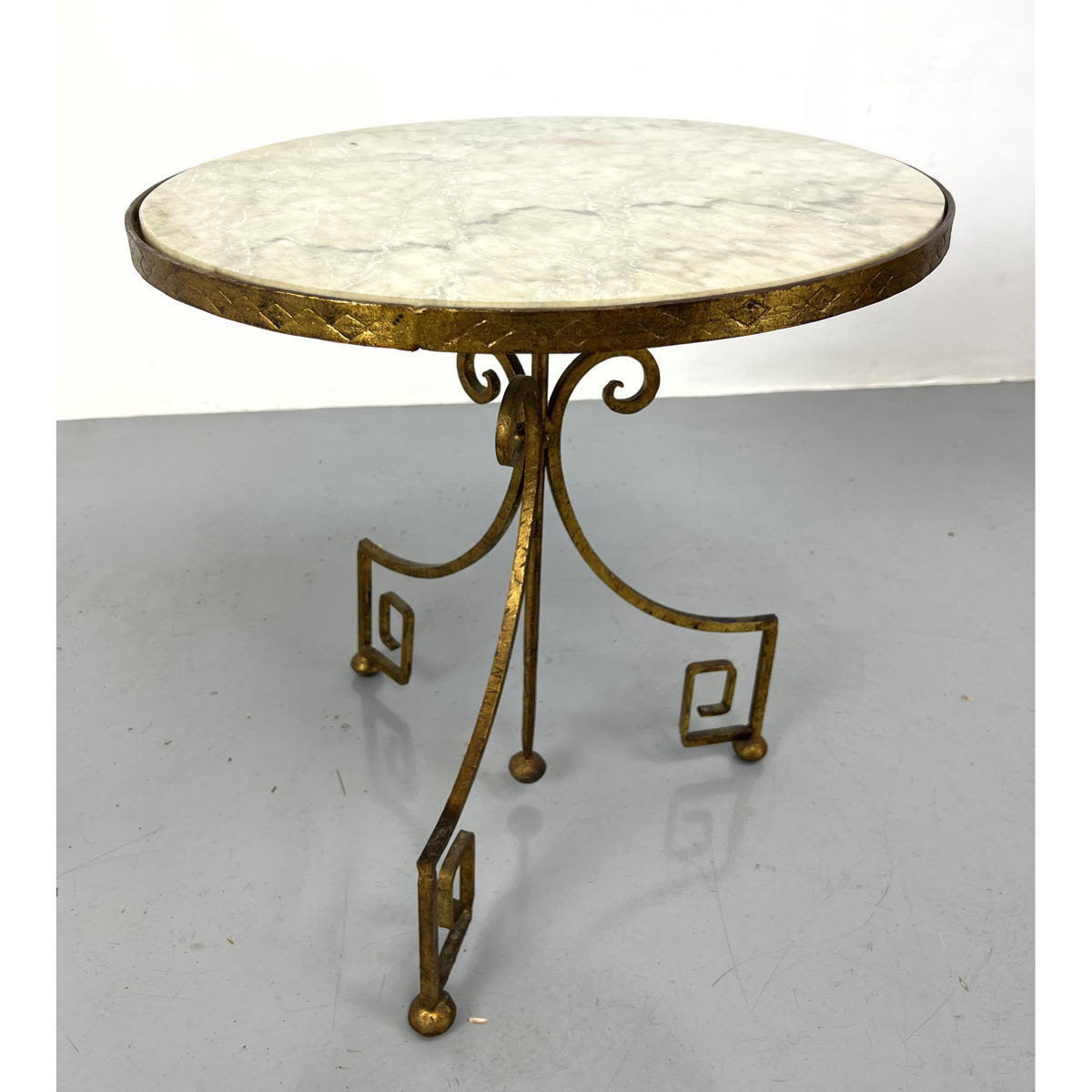 Appraisal: Marble Top Iron Gueridon Side Table Three Stylish Gilt Iron