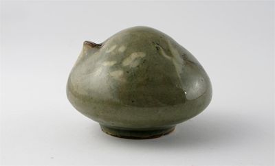 Appraisal: A Korean celadon glaze water dropper decorated in white slip