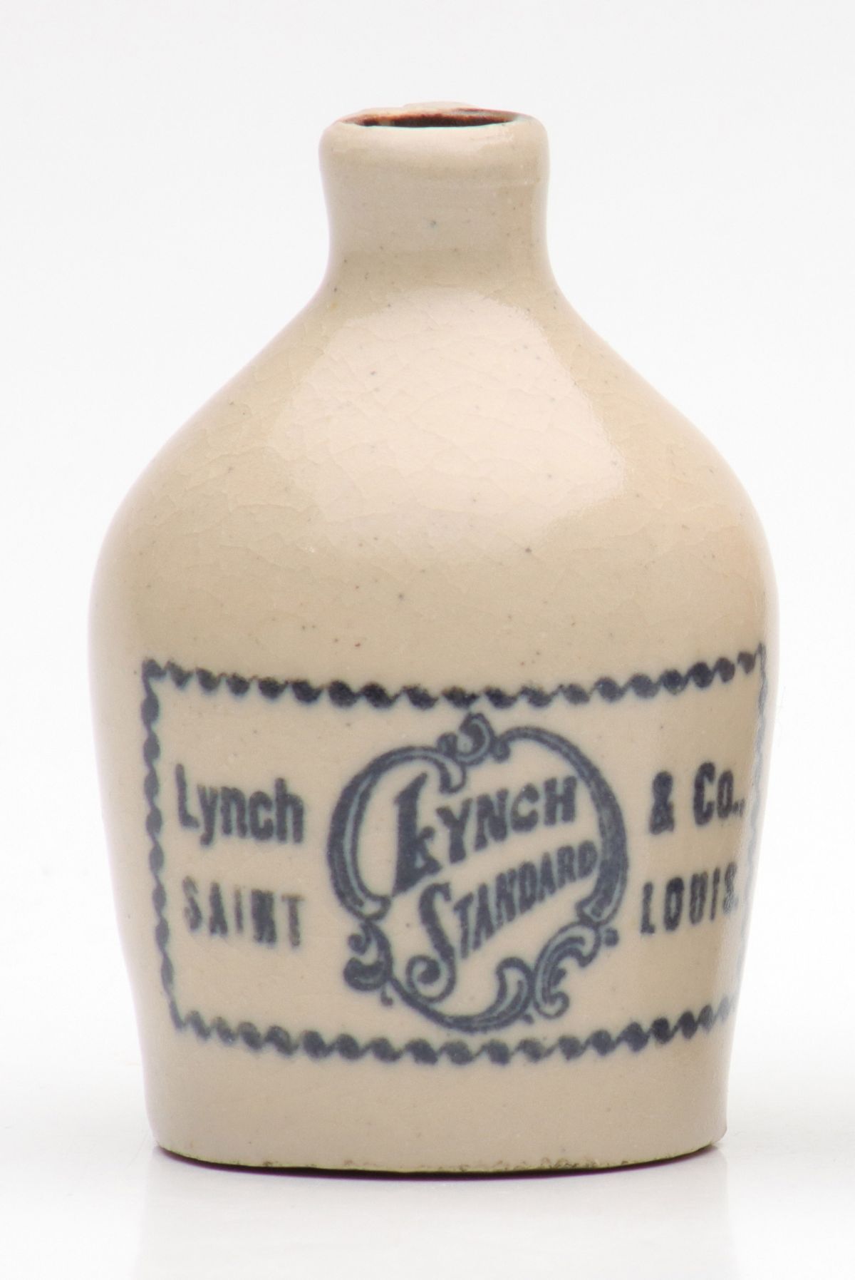 Appraisal: LYNCH STANDARD ST LOUIS WHISKEY STONEWARE MINI JUGThe condition is