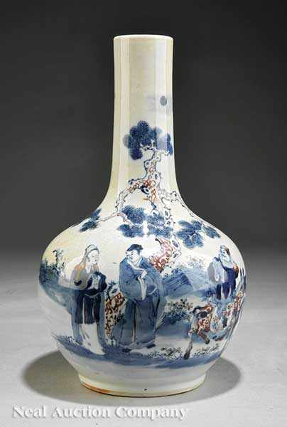 Appraisal: An Antique Chinese Red Decorated Blue and White Porcelain Bottle