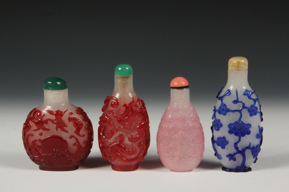 Appraisal: A GROUP OF OVERLAY GLASS SNUFF BOTTLES - Including A