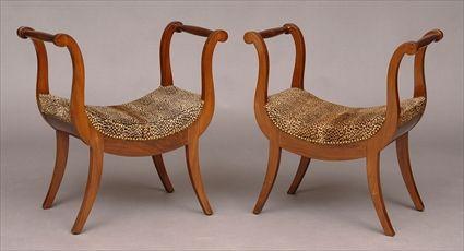 Appraisal: PAIR OF CONTINENTAL NEOCLASSICAL MAHOGANY STOOLS Each dipped seat flanked