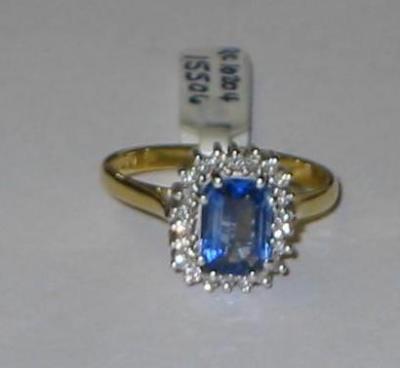 Appraisal: A SAPPHIRE AND DIAMOND CLUSTER RING the emerald cut pale