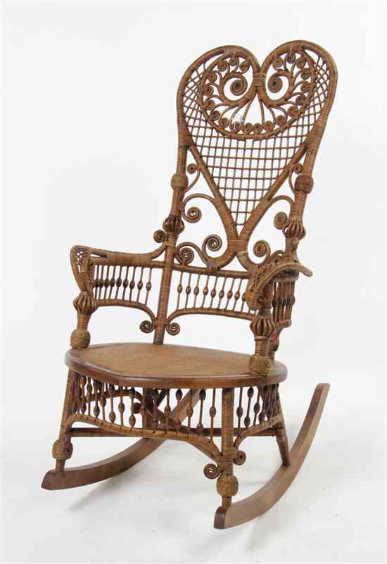 Appraisal: A Victorian Rattan Rocking Armchair attributed to Heywood Bros having