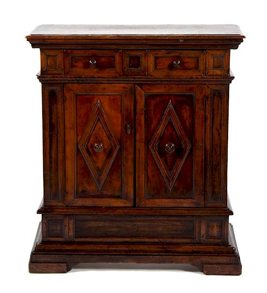 Appraisal: An Italian Walnut Cabinet An Italian Walnut Cabinet TH CENTURY