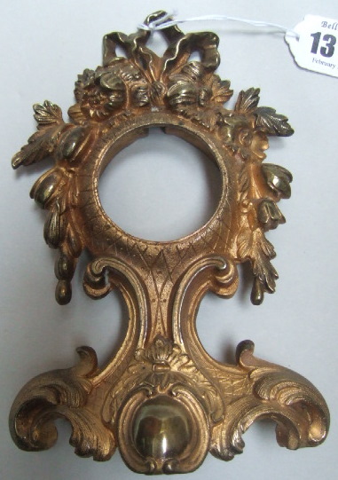 Appraisal: A gilt metal pocket watch stand of rococo floral and