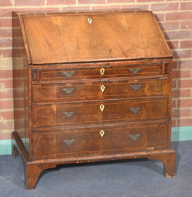 Appraisal: AN TH CENTURY WALNUT BUREAU the interior fitted pigeonholes and