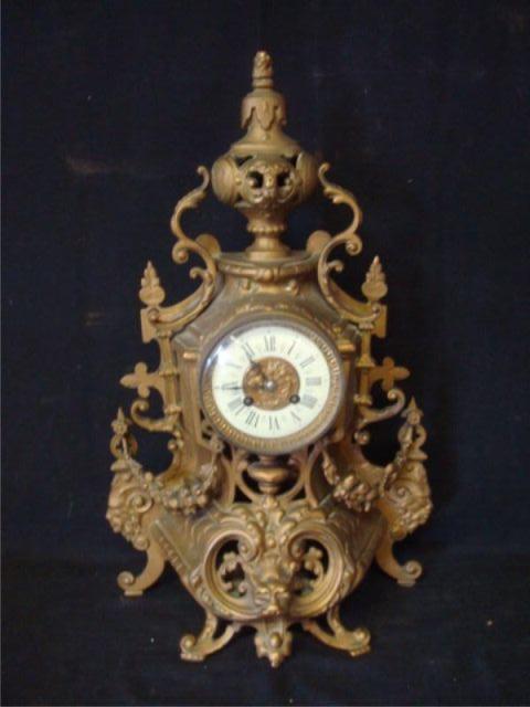 Appraisal: Bronze Rococo French Clock Enameled face clock From a Washington