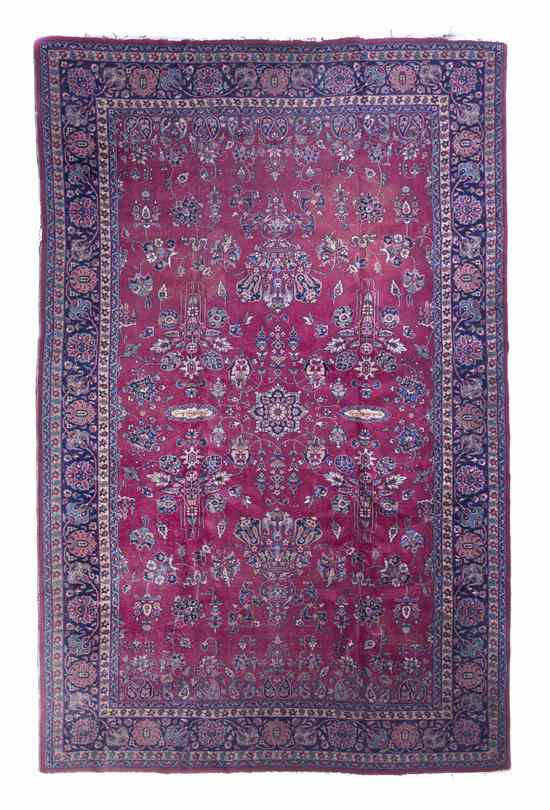 Appraisal: A Sarouk Wool Rug having allover stylized floral decoration on