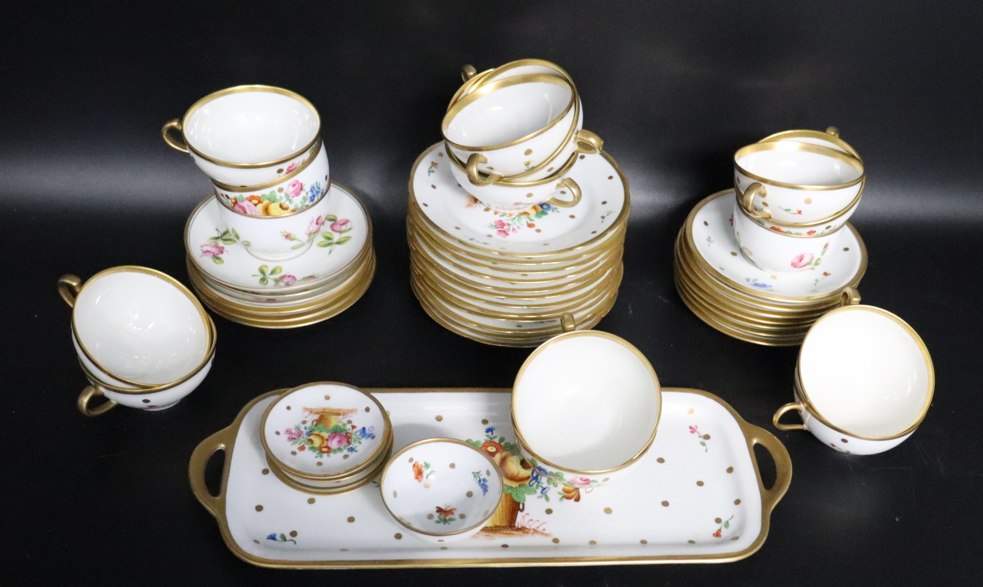 Appraisal: Limoges Porcelain Service To include saucers cup tray cups cups