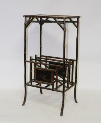 Appraisal: An Edwardian black lacquer and simulated bamboo magazine rack cm