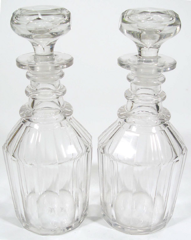 Appraisal: Pair of faceted cut glass decanters and stoppers with three