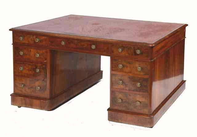 Appraisal: A VICTORIAN WALNUT RECTANGULAR PEDESTAL WRITING DESK with one long