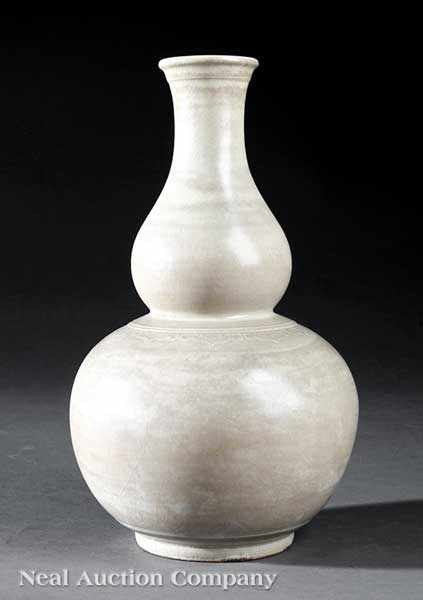 Appraisal: A Chinese Incised and Glazed Stoneware Double Gourd Vase probably