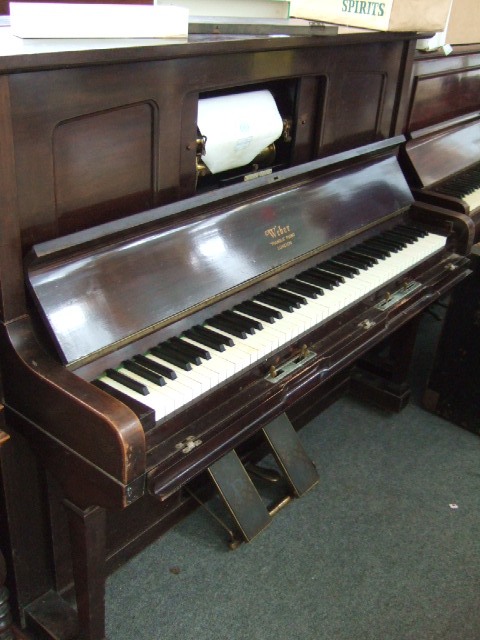 Appraisal: A th century iron framed overstrung mahogany case pianola by