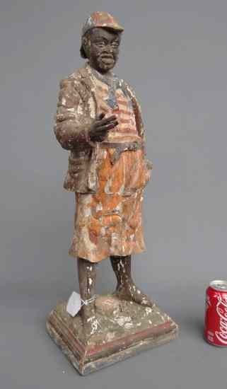 Appraisal: Counter top wooden painted cigar store figure African American boy