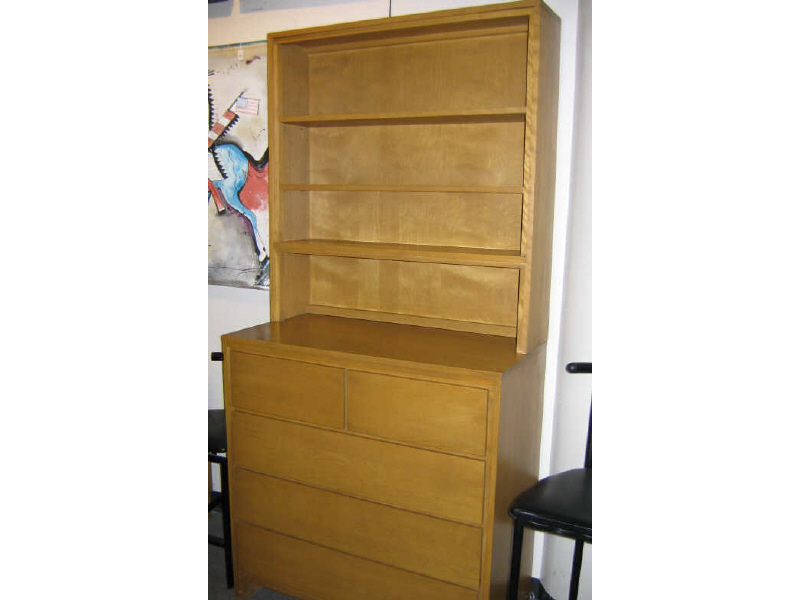 Appraisal: CONANT BALL ESTABLISHED Blond ensemble comprising a bookcase and drawer