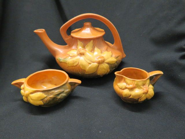 Appraisal: Roseville Pottery Clematis Tea Set brown teapot is tall excellent