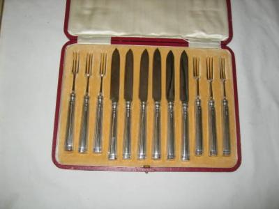 Appraisal: A SET OF SIX PAIRS OF DESSERT KNIVES AND FORKS