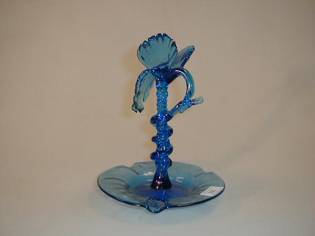 Appraisal: A blue glass ashtray pipe stand with Phoenix topped centre