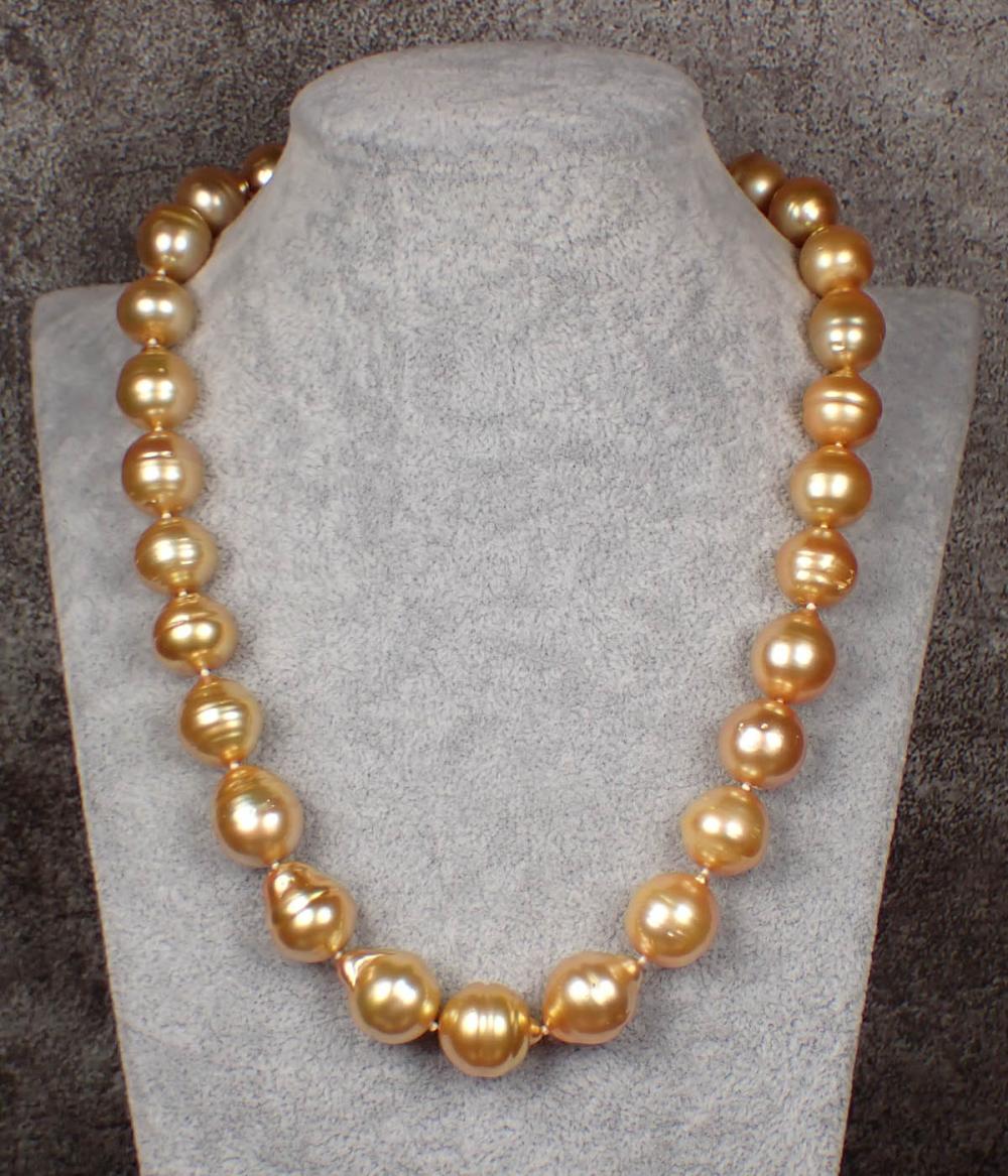 Appraisal: PRINCESS LENGTH GOLDEN SOUTH SEA PEARL NECKLACE hand-knotted strand of