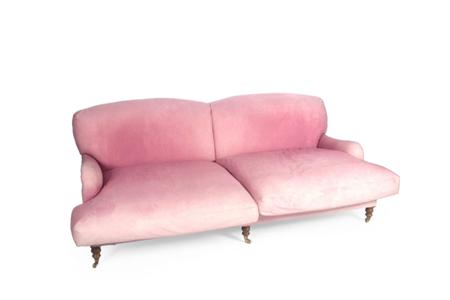 Appraisal: A pink upholstered sofa the double arched cushioned back over