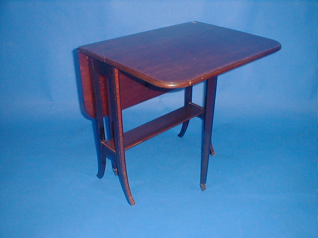 Appraisal: An Edwardian mahogany Sutherland table with cross banded satinwood top